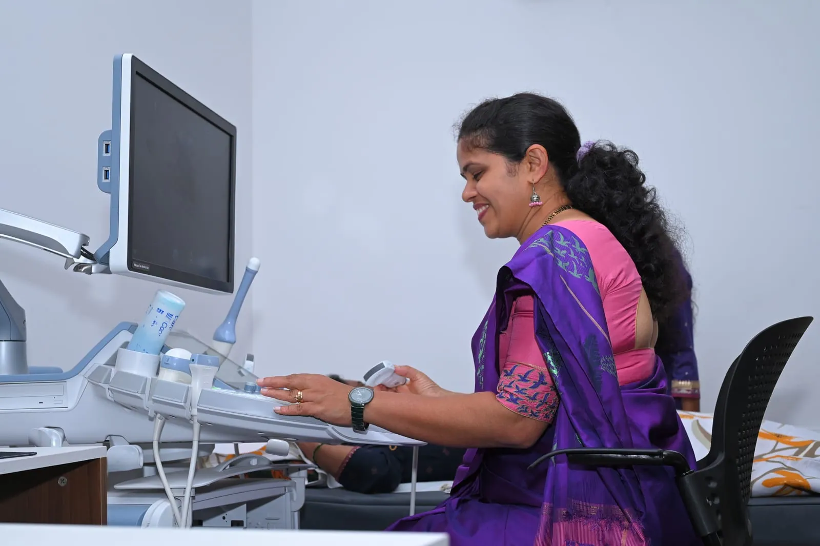 Dr. Mamatha performing an ultrasound scan at Suprama Diagnostics